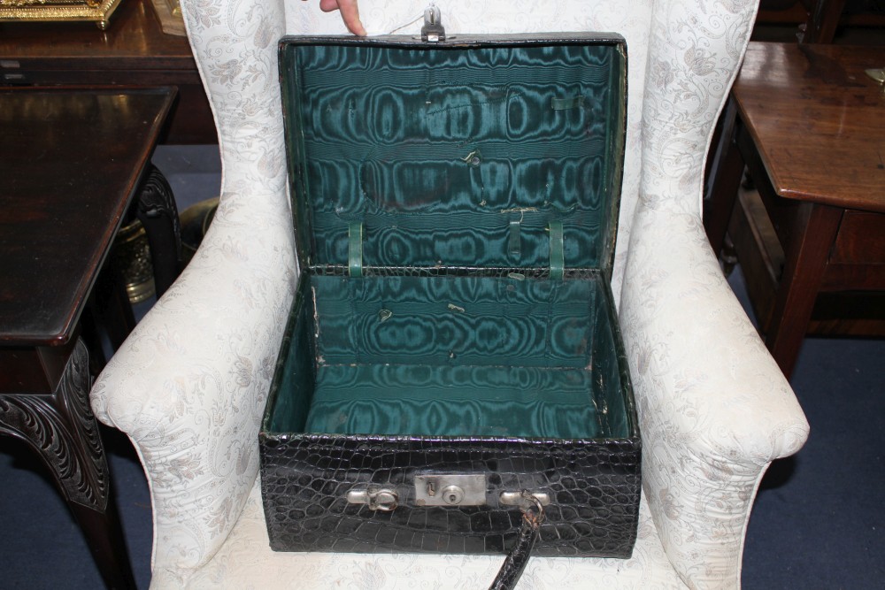 An early 20th century black crocodile toilet case, 40 x 33 x 18cm